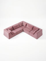 Modo 5-piece modular sectional sofa with corner seating in faded rose pink performance fabric, studio photo