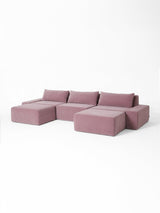 Modo 3 piece (142") sofa with 2 ottomans in faded rose pink velvet, studio photo