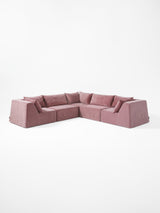 Modo 5-piece modular sectional sofa with corner seating in faded rose pink performance fabric, studio photo