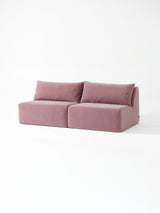 Modo armless (80") sofa in faded rose pink velvet, studio photo