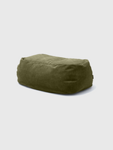 A rectangular sage green Dume Ottoman with a smooth fabric cover.